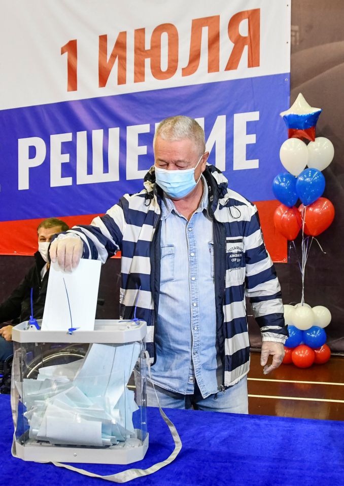 A man casts his ballot at a polling station during a seven-day vote for constitutional reforms