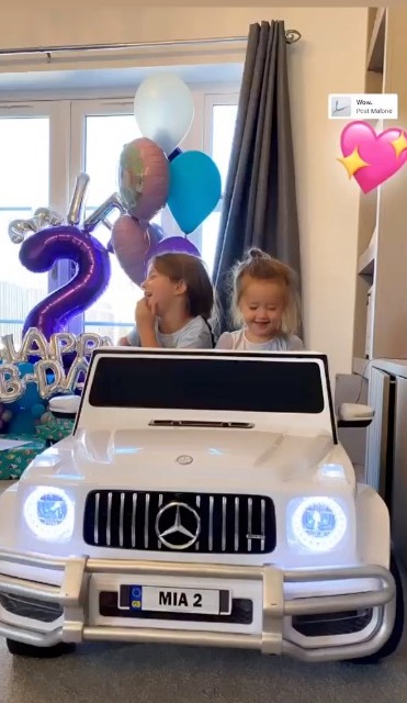  Ella and Mia are thrilled with the toddler's birthday present