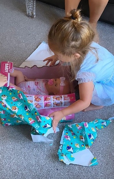  Mia loved unwrapping her presents