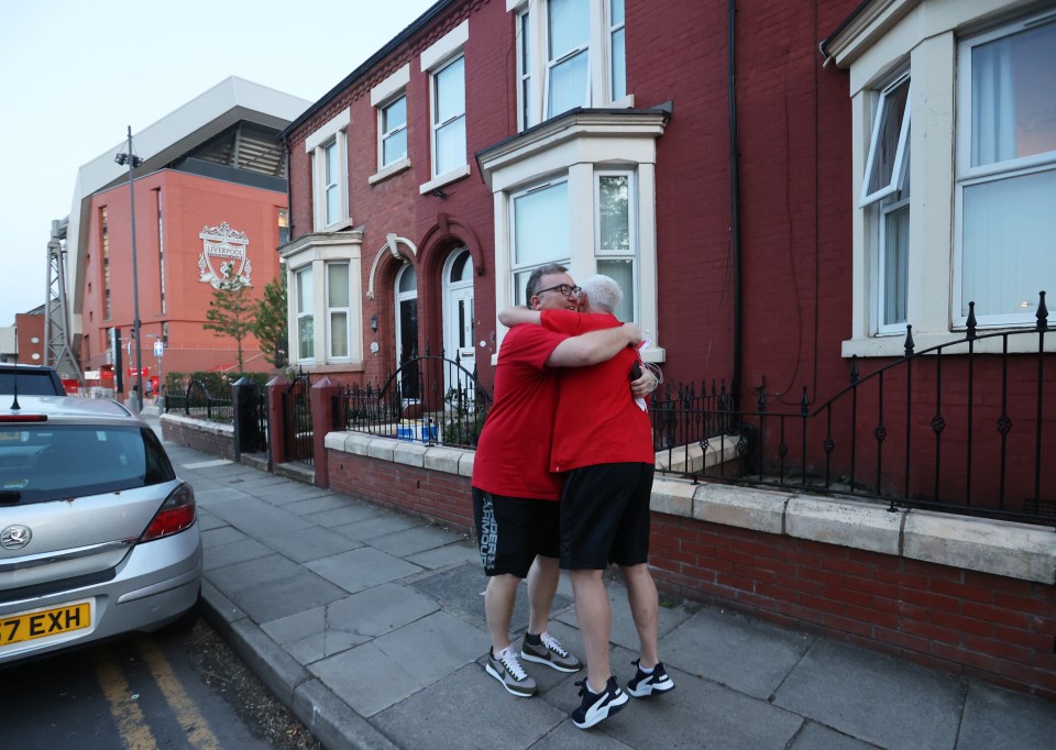 Two Liverpool fans after their club were crowned champions of England 