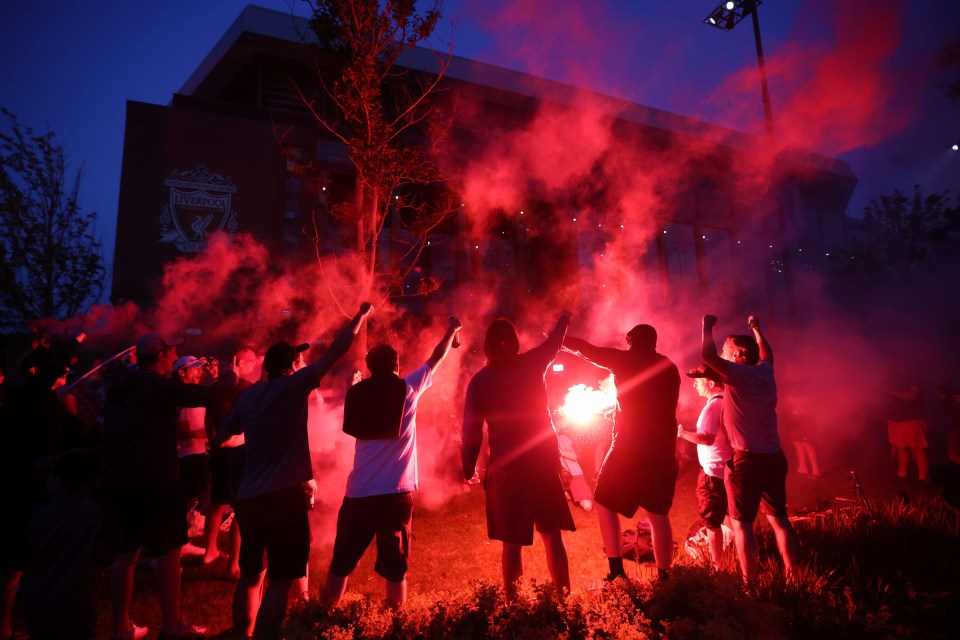 Jubilant Liverpool fans set off flares after winning their first title for 30 years