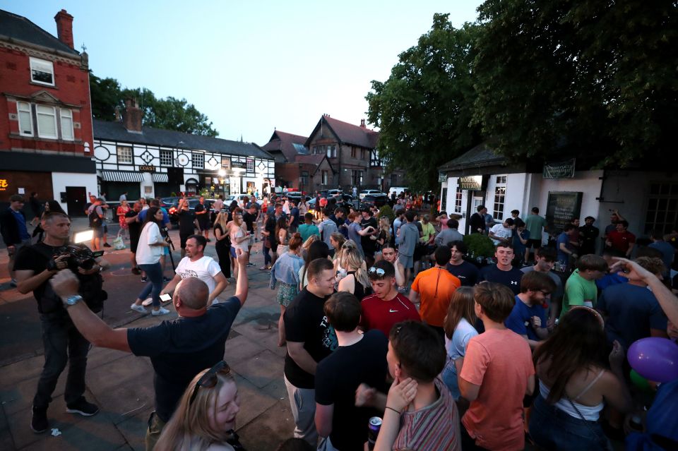 Liverpool fans celebrate on the streets after lifting the league title