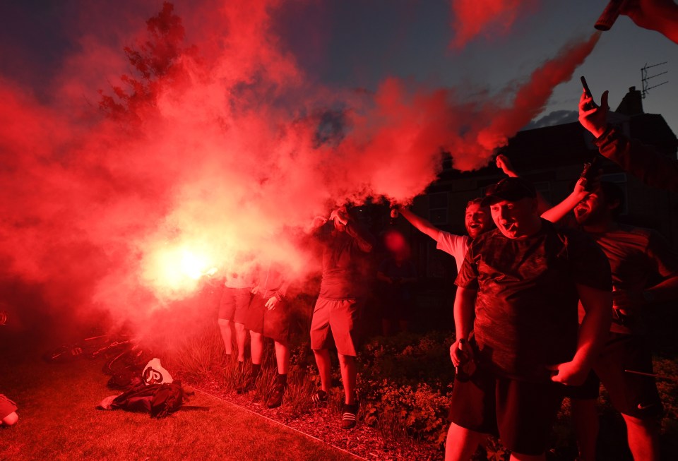 Liverpool fans celebrate as Man City's loss against Chelsea handed them the Premier League title 