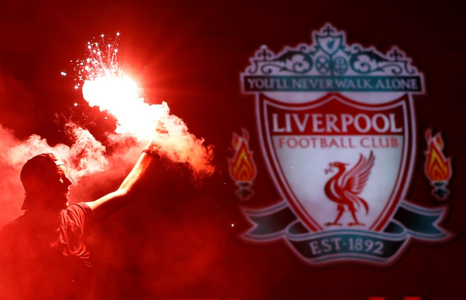 Liverpool fans set off flares after ending their 30 year wait for the title