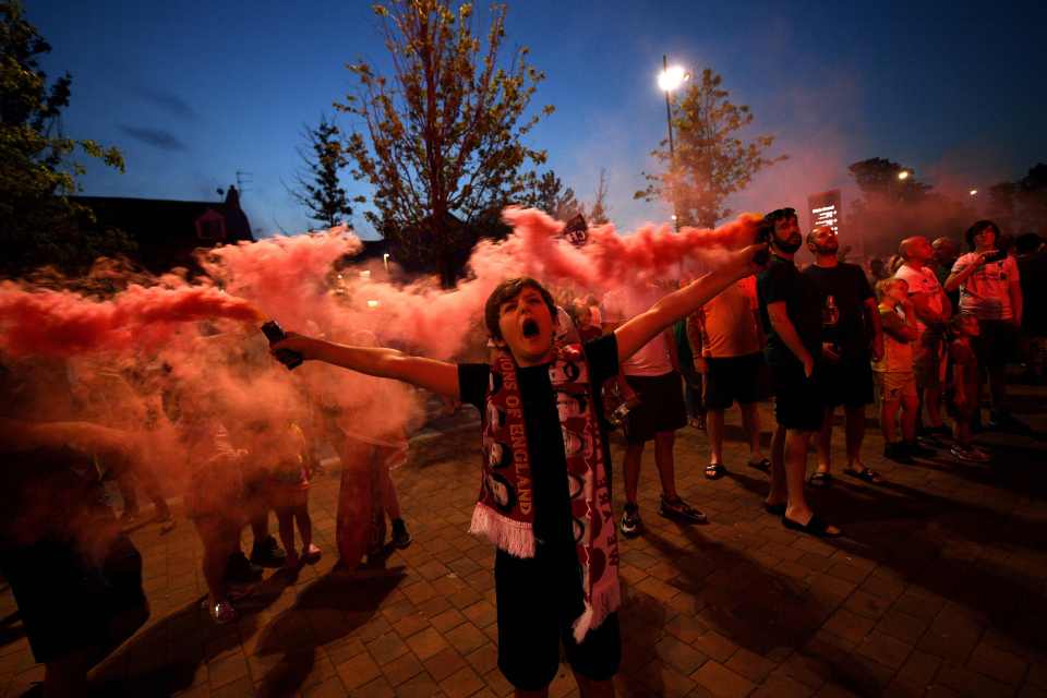 A fan screams with delight after Liverpool's title win