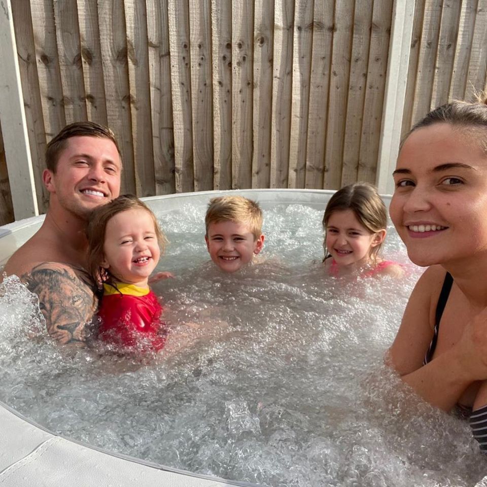 Jac and Dan in the hot tub with the kids