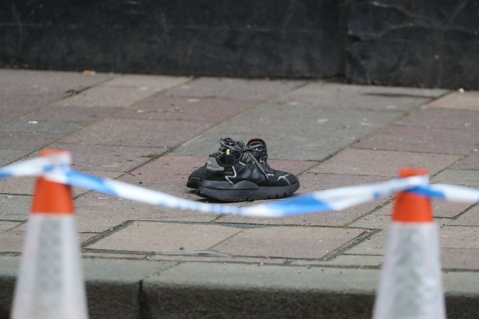  A pair of trainers pictured at the scene on Sunday