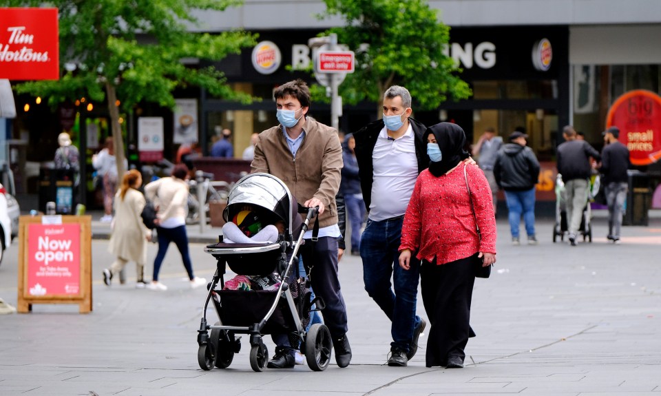 A group walking in Leicester city centre, where it is feared a local lockdown may have to be introduced 