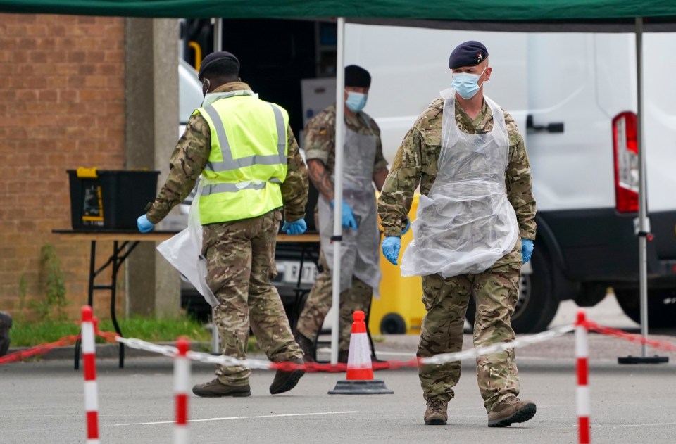 Members of the military work at a mobile testing centre in Leicester