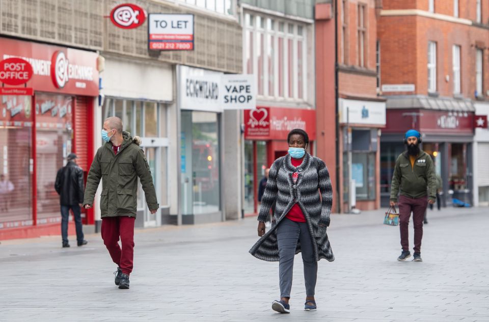 People walk through the city after it was announced it would be put in lockdown for another two weeks