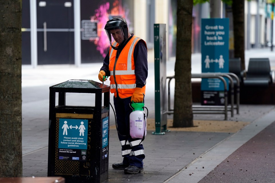 A man cleans a bin amid the safety concerns