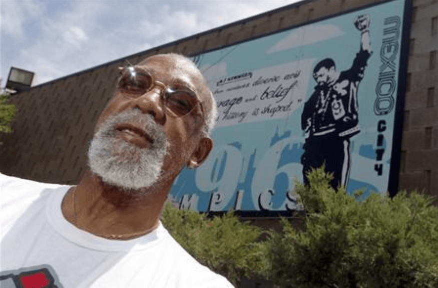  John Carlos, who competed in the 1968 Olympics, stands in front of a mural of his clenched fist made by students at Palm Springs High School