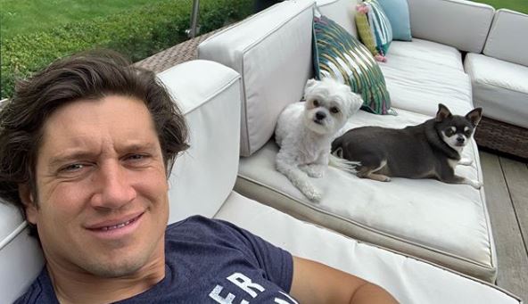  The host shared a cosy snap on his garden furniture with his pet pooches