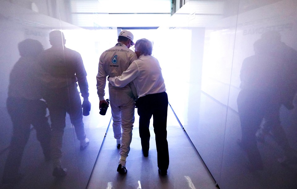 Bernie hugs Lewis Hamilton ahead of the Abu Dhabi Formula One Grand Prix in Abu Dhabi in 2014