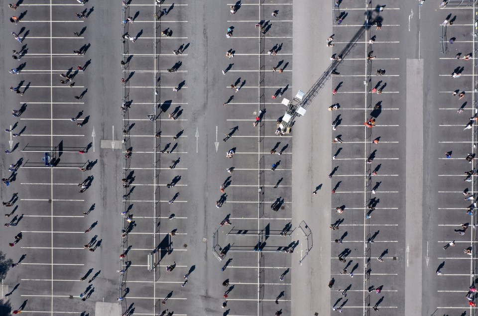 Aerial shots show customers waiting to get inside in Warrington