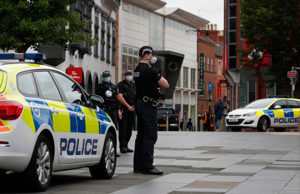  Police officers stand guard in Leicester during the local lockdown