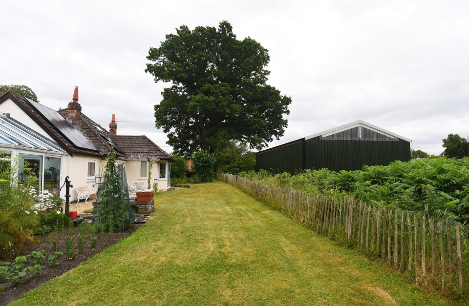 The barn-like building is in direct view of their house