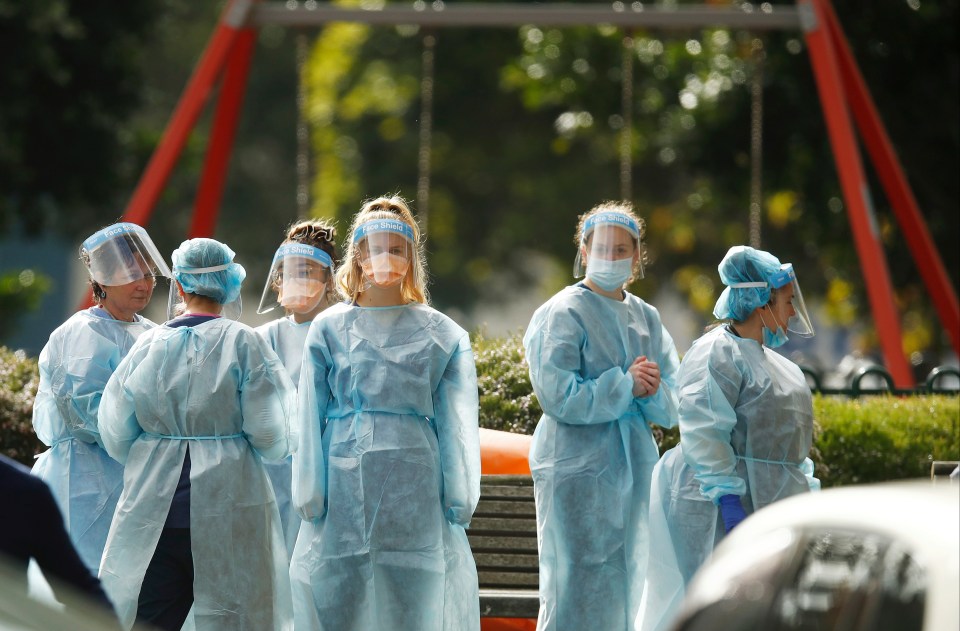 Workers in personal protective equipment in Victoria's capital, Melbourne