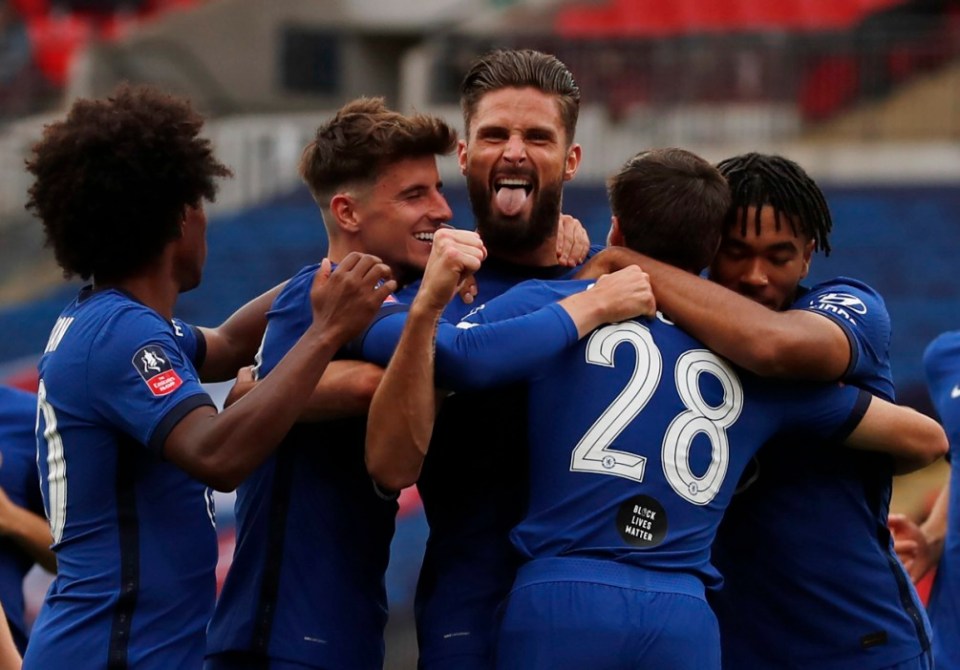 Olivier Giroud (pictured centre) was on target for Chelsea during their 2-0 win against Wolverhampton Wanderers on Sunday