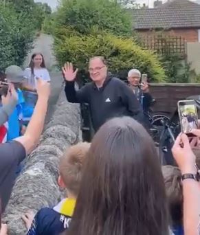 Bielsa outside his home as Leeds fans celebrate