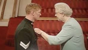 Trevor Coult being given an award by the Queen