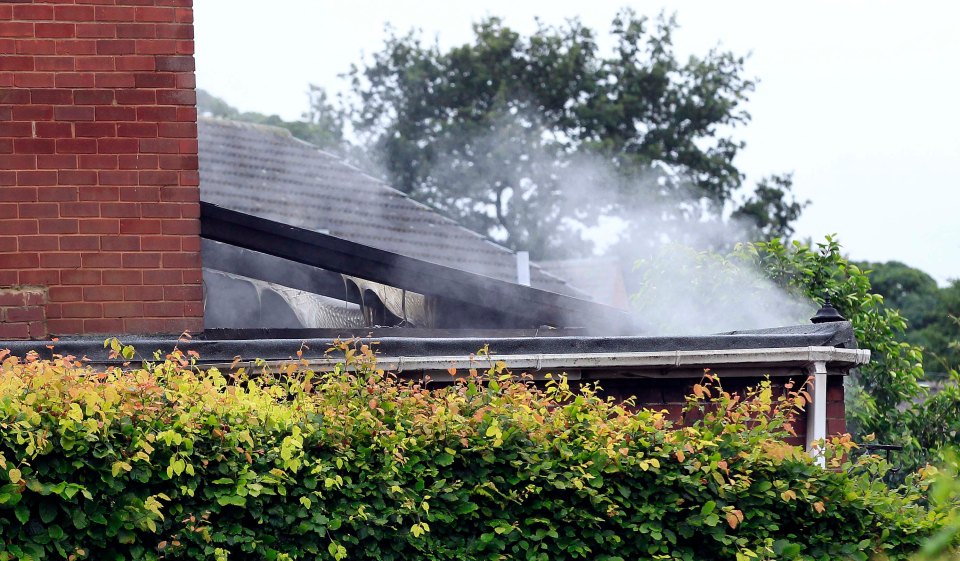 Smoke can be seen coming from the house