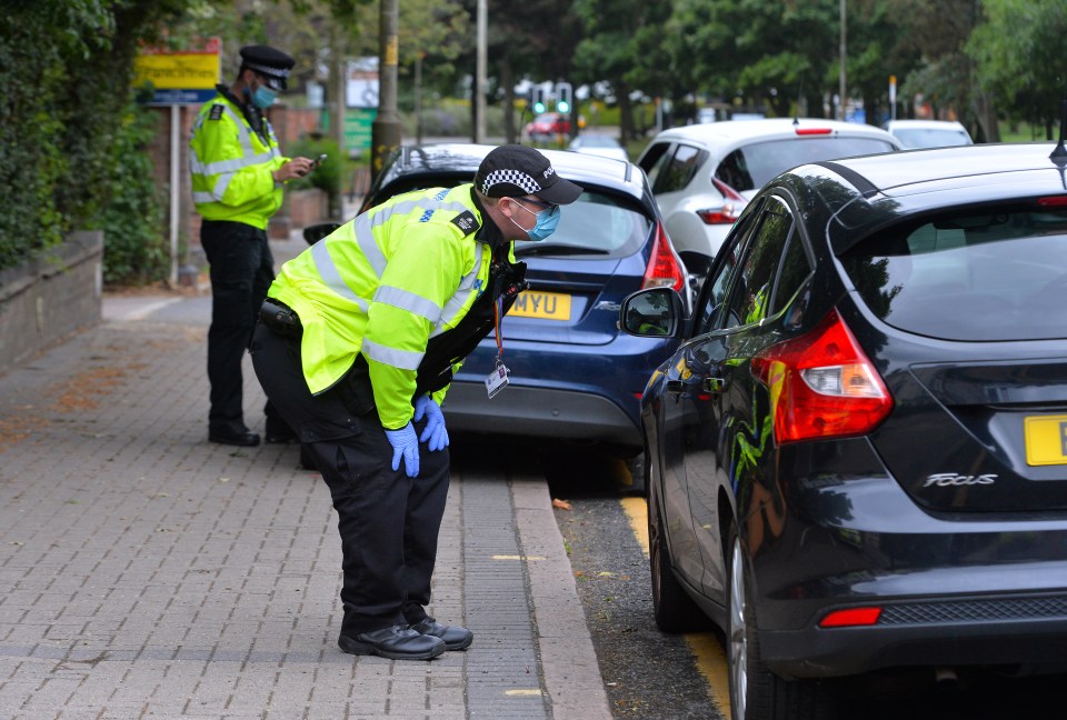 Cops checking cars as part of the local measures