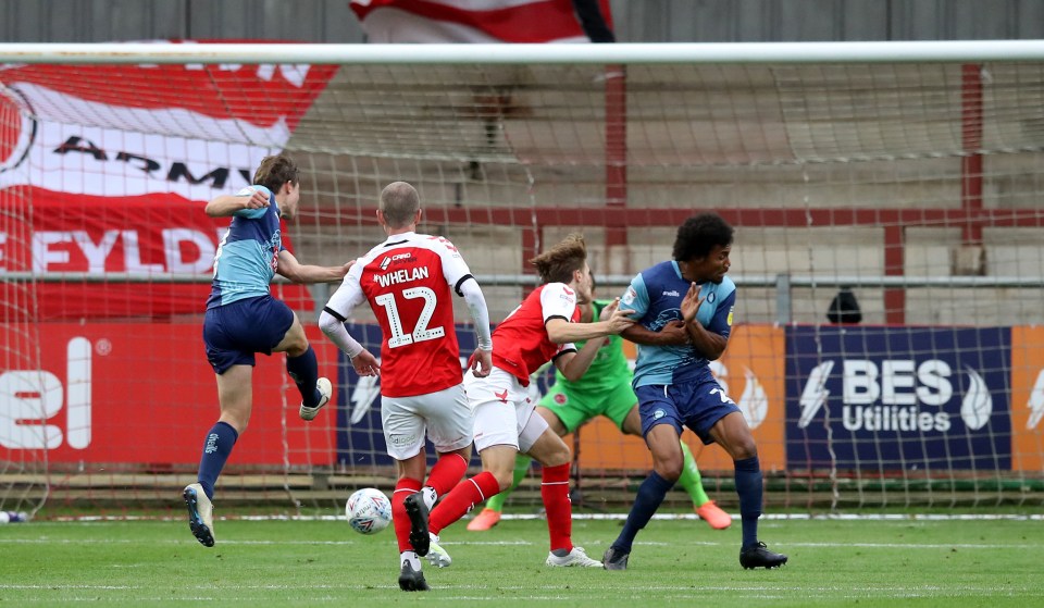 David Wheeler (left) scores his Wycombe’s third as they took a giant stride towards Wembley