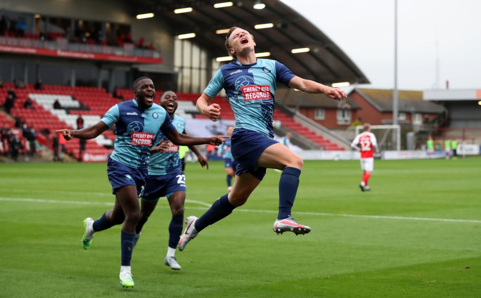 Wycombe Wanderers Alex Samuel celebrates scoring his side’s fourth of the night after a pulsating contest