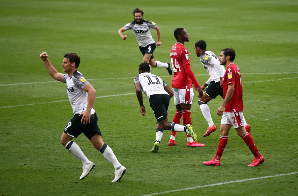 Chris Martin celebrates his 97th-minute equaliser for Derby