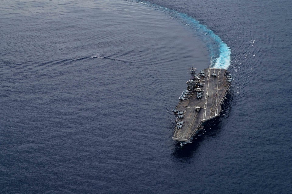 USS Ronald Reagan carries out maneuvers in the South China Sea