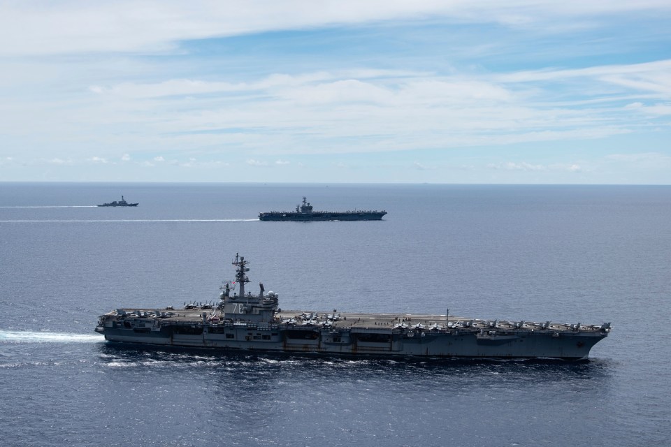 USS nimitz and USS Ronald Reagan sail together in the South China Sea