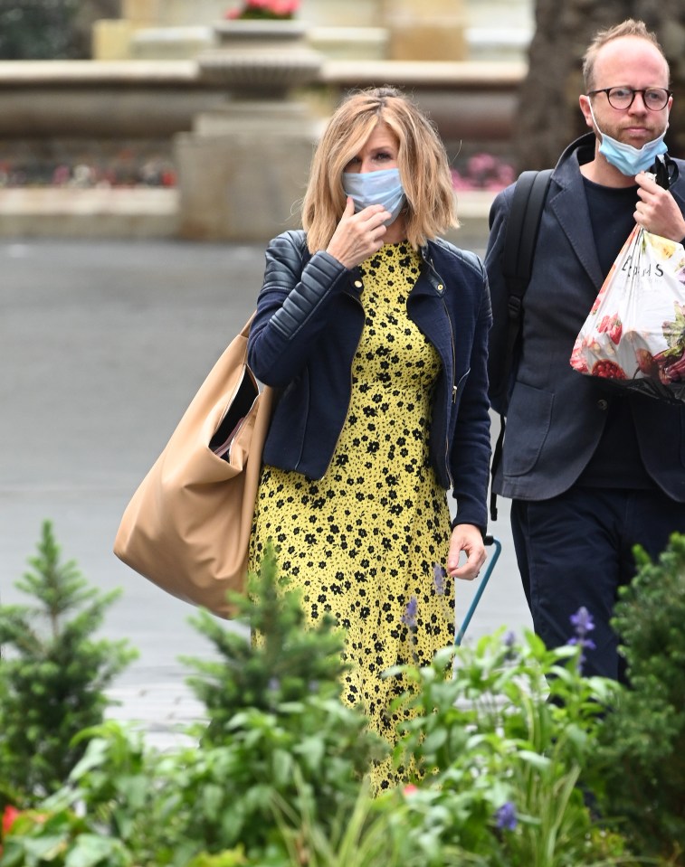 Brave Kate put on a defiant display in a yellow maxi dress and black leather jacket