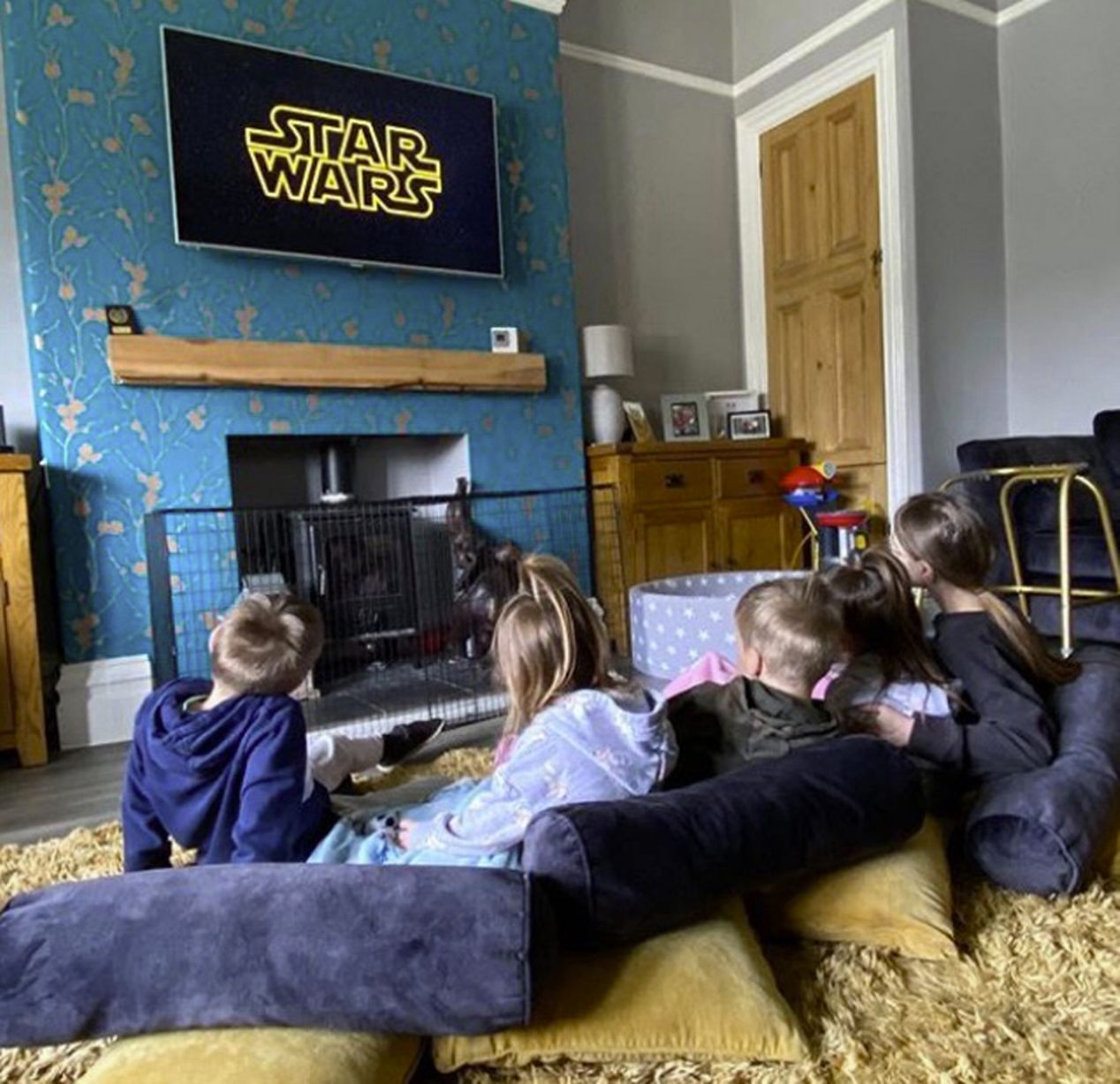 Movie night at the Radfords looks cosy in their blue and yellow lounge