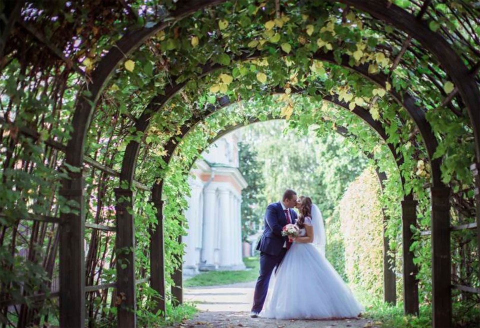 The bride and groom pictured at their wedding in Tsaritsyno Palace