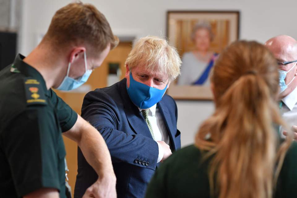 Boris Johnson elbow-bumped medics in London yesterday