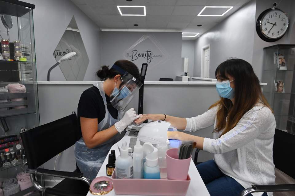 Lynsey Scott donned a face mask as she indulged in a manicure at a nail salon in Birkenhead