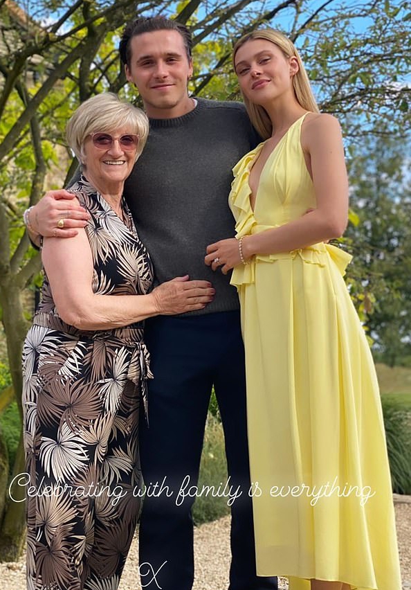 The happy couple posed with Brooklyn's grandparents