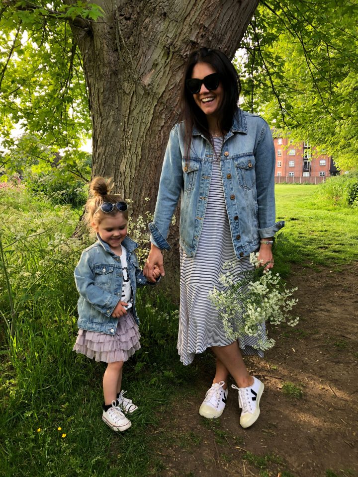 Carly says that before becoming a mum  her wardrobe was 'functional and fashionable' but here she is matching with Daisy in denim jackets and dresses