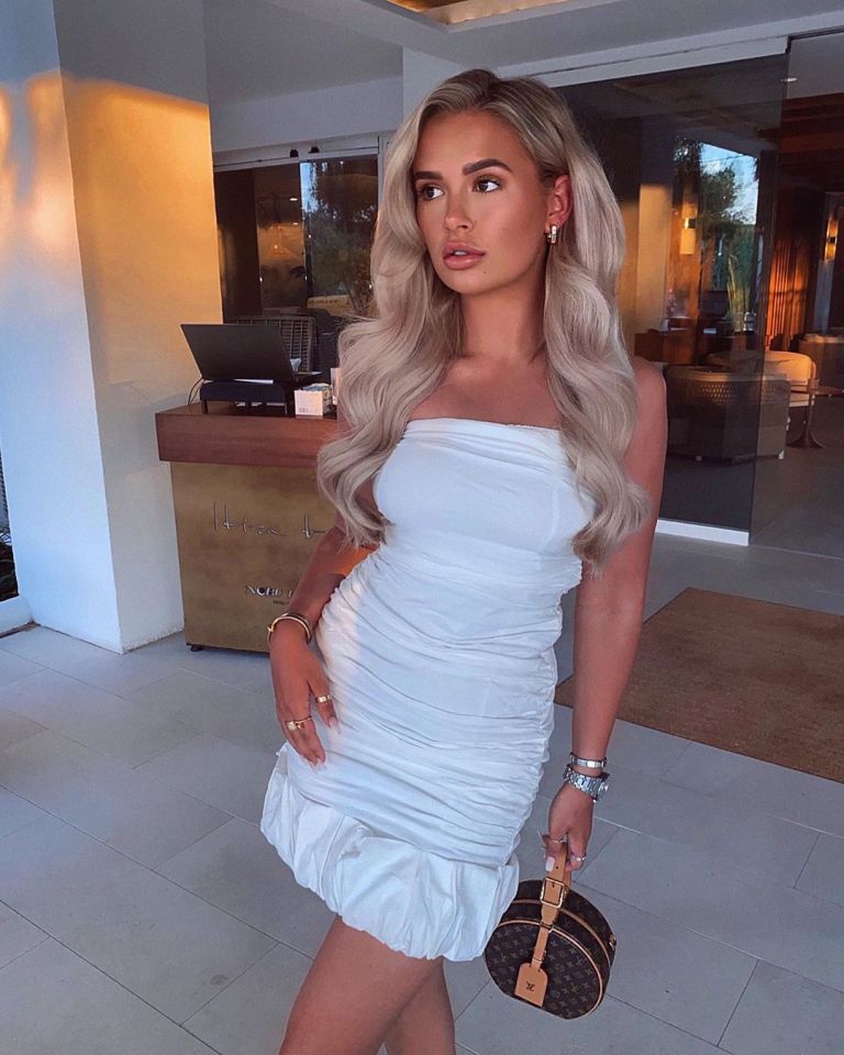 Stunning Molly heads out for dinner in a white boob-tube mini-dress