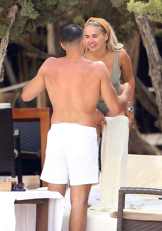 Tommy chatted to Molly-Mae as she stood on her sun bed to put her bottoms on