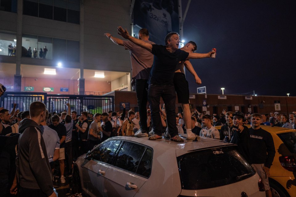 Some supporters climbed on to cars to party