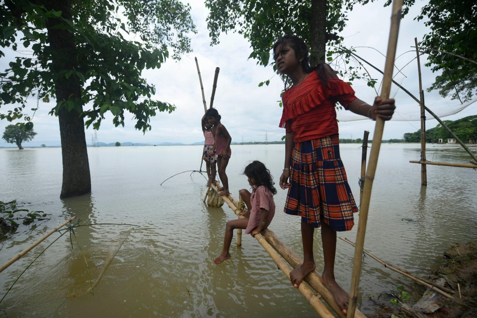 Rescue teams are facing a double challenge of rising flood waters amid the coronavirus pandemic