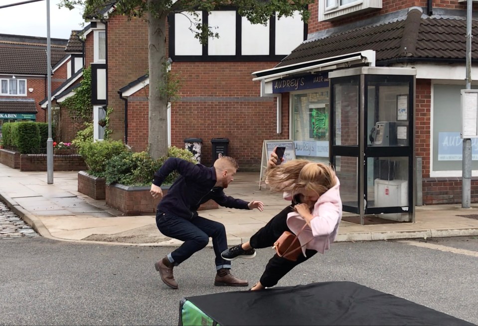 Actress Tina O'Brian falls onto a mattress