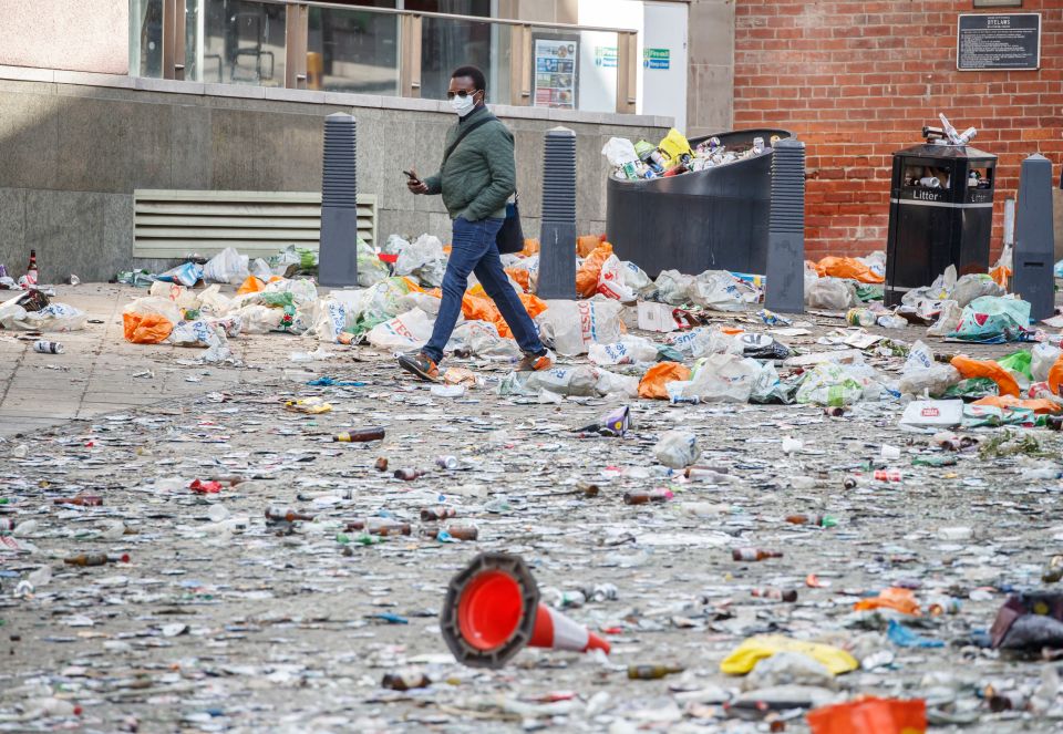 A man surveys the post-party streets in Leeds city centre