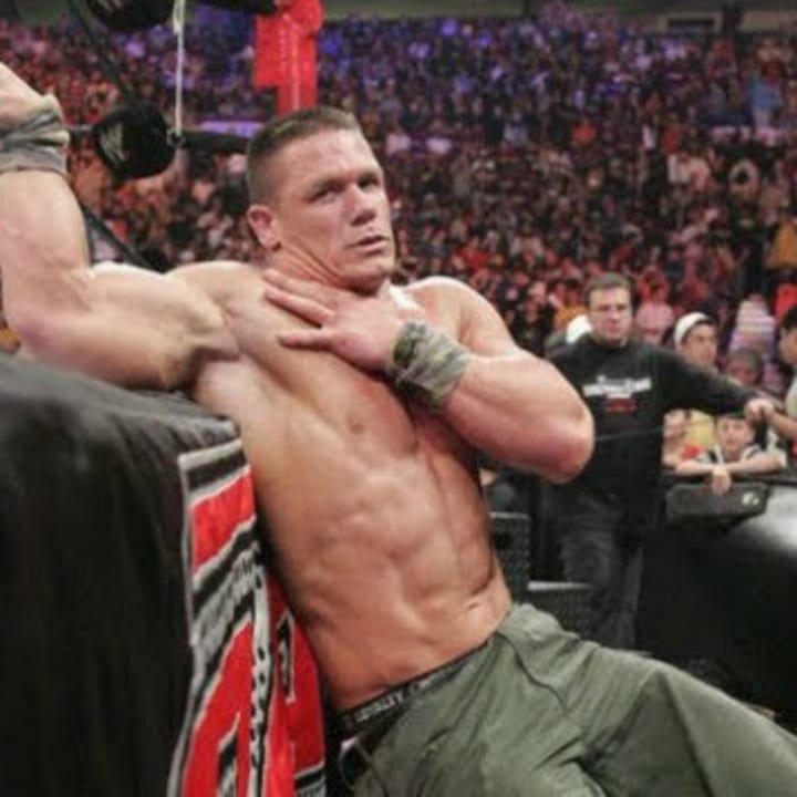 John Cena clutches his torn pectoral muscle