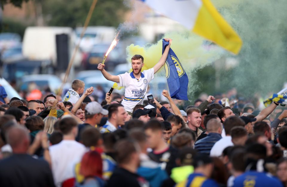 Leeds supporters also lit flares and celebrated their team's Championship win