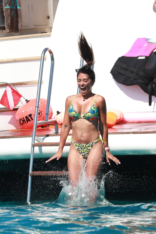 Messi's childhood sweetheart takes a plunge off the back of the yacht