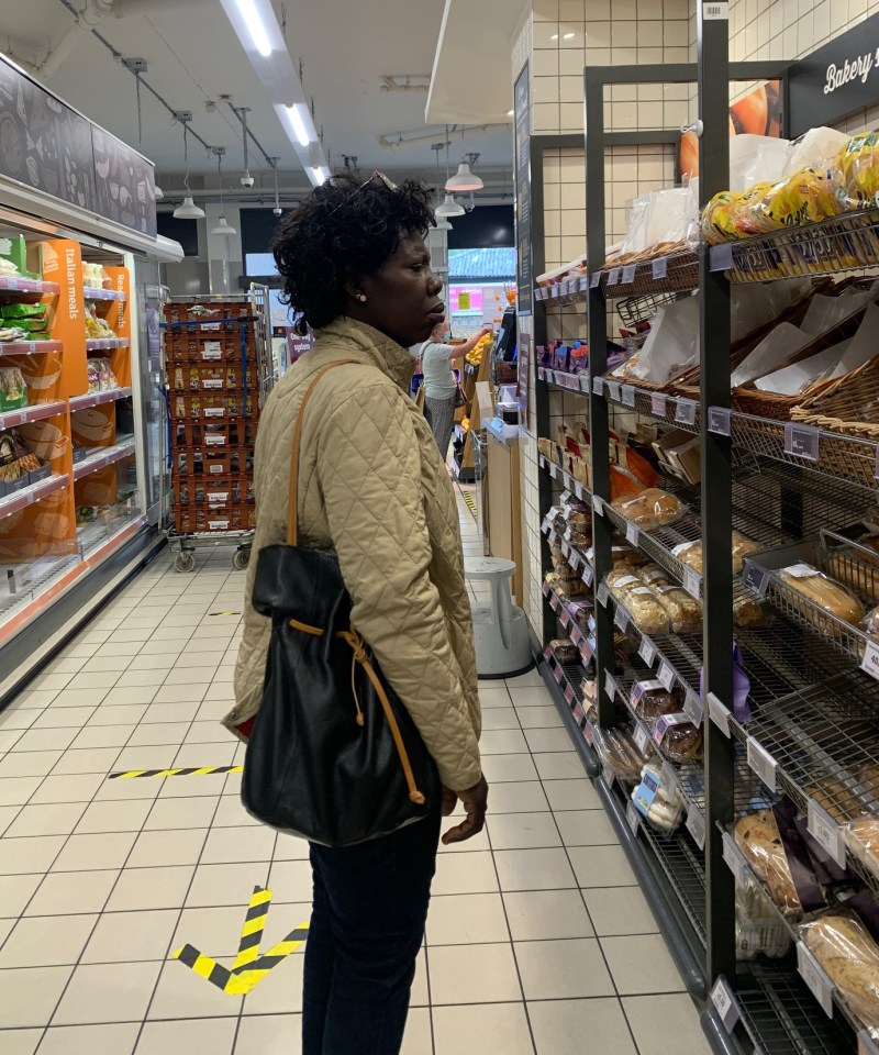 A woman not wearing a face mask in Sainsbury's