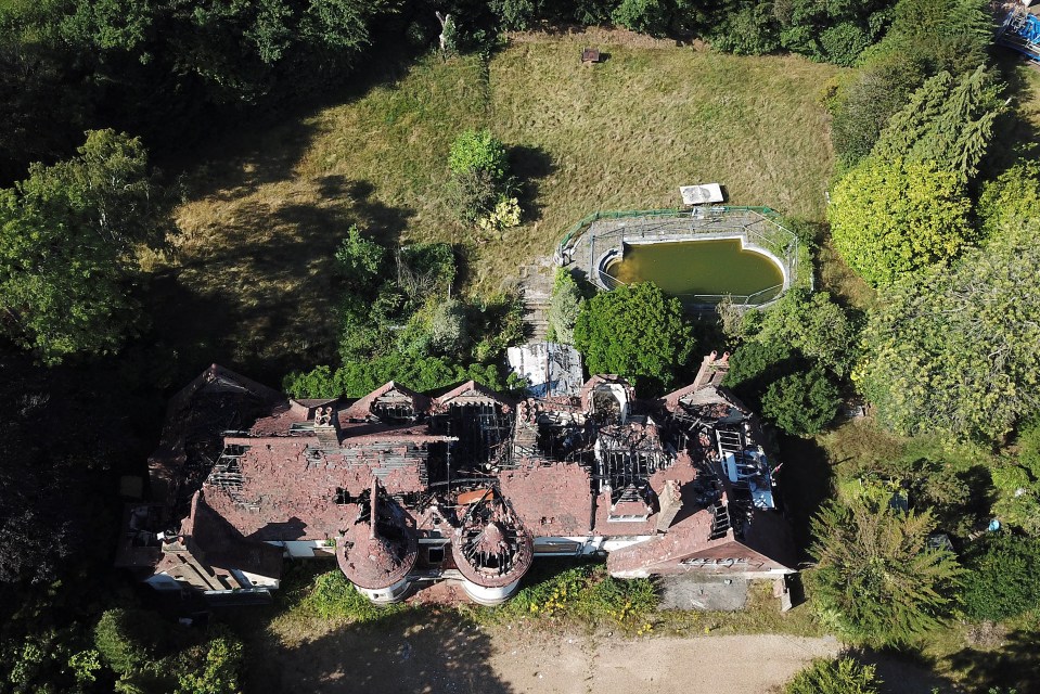 An aerial shot of Oritsé Williams’ derelict house, one year after it was burnt down